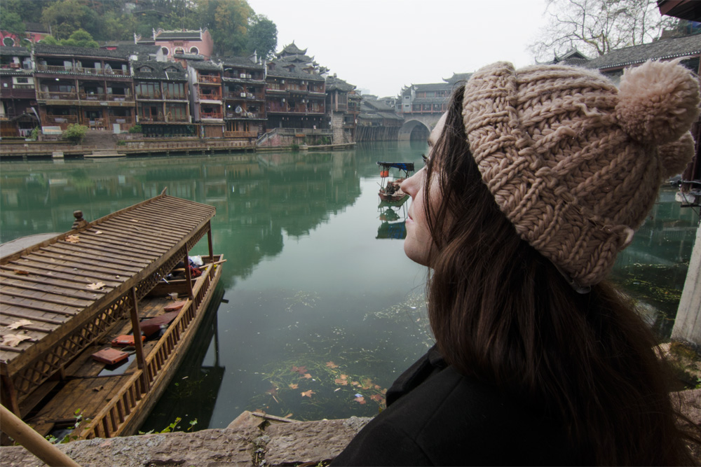 girl looking at river temples, Packing list for China in winter, china winter packing list, what to wear in china winter