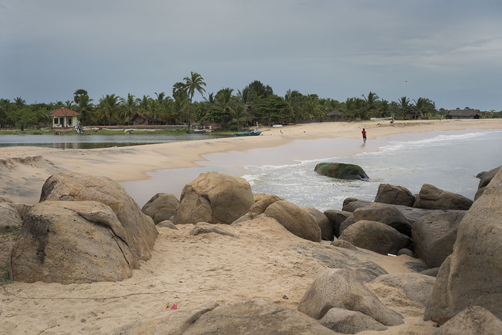 a beach and river split by sand  in "sri lanka packing list" article