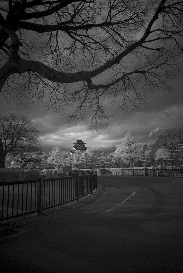 Black and white image of far away japanese temple for my japan winter packing list article