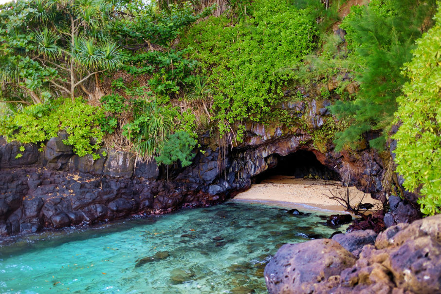 A tiny beach with a cave on my Kauai winter packing list post