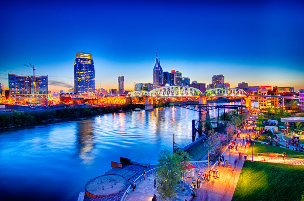 Nashville on the river at night lit up by lights on my nashville spring packing list post